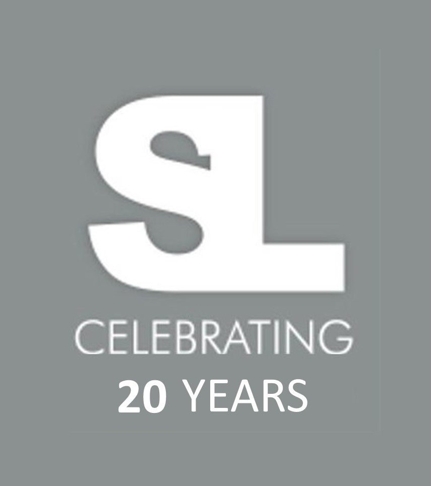 A white logo that says celebrating 2 0 years.